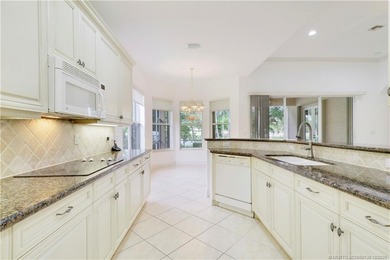 Step into light-filled elegance in this meticulously maintained - photo 19