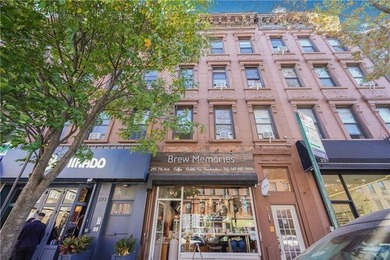 Presenting this mixed-use brick building with one retail store - photo 2