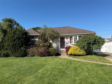Set on a 60x100 lot in The Forest City section of Wantagh in - photo 1
