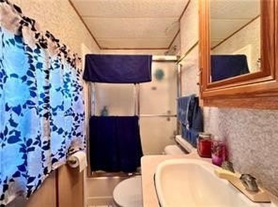 Introducing a charming property nestled on the serene shores of - photo 11