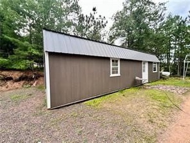 Introducing a charming property nestled on the serene shores of - photo 17