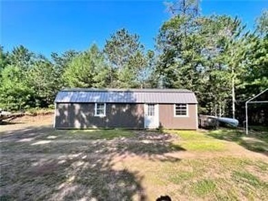 Introducing a charming property nestled on the serene shores of - photo 18