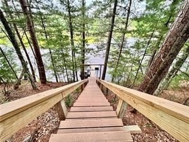 Introducing a charming property nestled on the serene shores of - photo 22