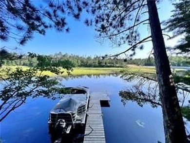 Introducing a charming property nestled on the serene shores of - photo 23