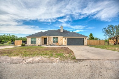 Discover this charming 3-bedroom, 2-bathroom home located in the - photo 2