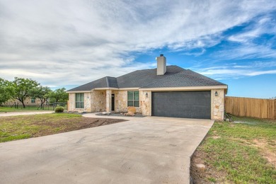 Discover this charming 3-bedroom, 2-bathroom home located in the - photo 3