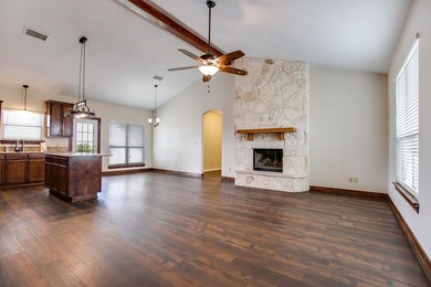 Discover this charming 3-bedroom, 2-bathroom home located in the - photo 6