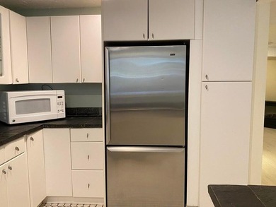 Three-level condominium offering space, flexibility, and a prime - photo 9