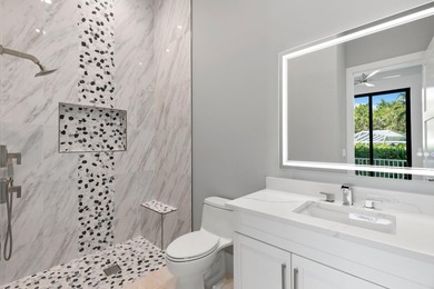 A Waterfront Masterpiece of Modern Island Living! Bold, fresh