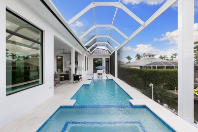 A Waterfront Masterpiece of Modern Island Living! Bold, fresh
