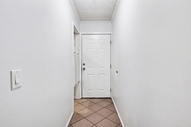 Welcome to this charming two-bedroom, two-bathroom condo in the