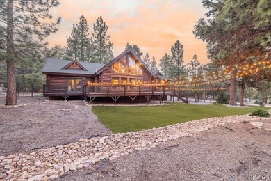 Nestled among the pines on a beautifully wooded acre, this - photo 2