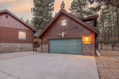 Nestled among the pines on a beautifully wooded acre, this - photo 5