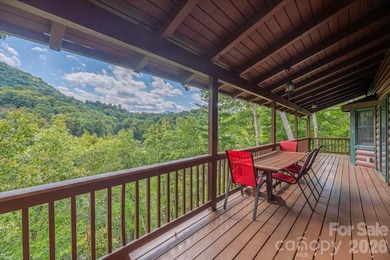 This warm and inviting, solidly built custom log home is - photo 2