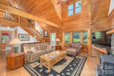 This warm and inviting, solidly built custom log home is - photo 5