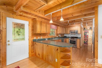 This warm and inviting, solidly built custom log home is - photo 9