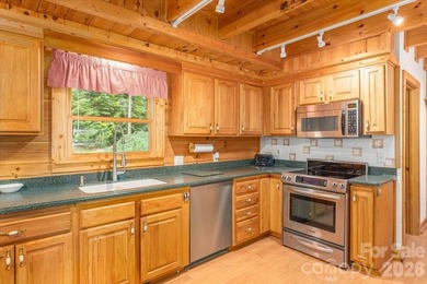This warm and inviting, solidly built custom log home is - photo 10