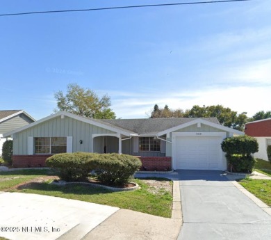 Lake Home For Sale in Holiday, Florida