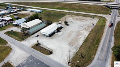Commercial building and large tract located at the corner of 65 - photo 2
