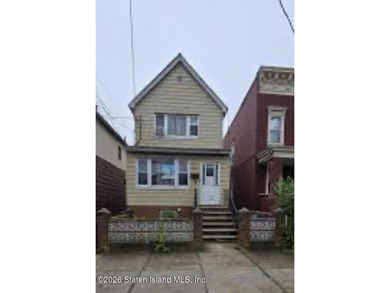 Two-family home in Canarsie featuring two 2-bedroom, 1-bath - photo 2