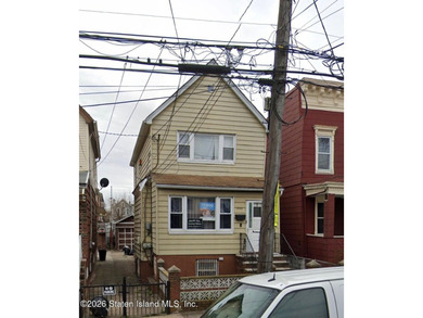 Two-family home in Canarsie featuring two 2-bedroom, 1-bath - photo 3