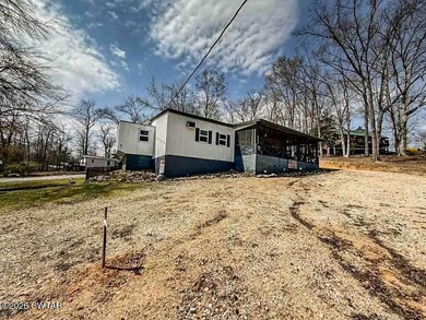 4 bedroom, 1 bath home with a huge covered area perfect for - photo 1