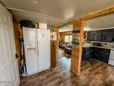 4 bedroom, 1 bath home with a huge covered area perfect for - photo 2