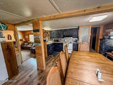 4 bedroom, 1 bath home with a huge covered area perfect for - photo 4