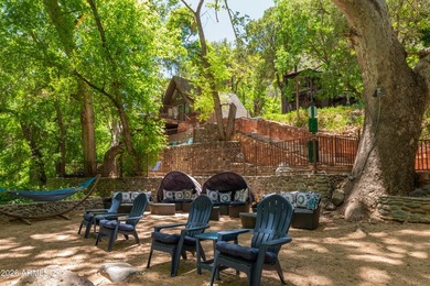 Set beneath the canopy of mature pines and just steps from the - photo 27
