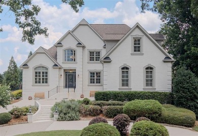 Nestled on a private cul-de-sac within the prestigious gates of - photo 1