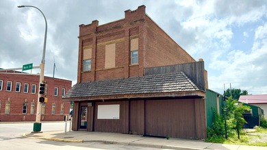 Located on the highly visible corner of Highway 212 and Main - photo 2
