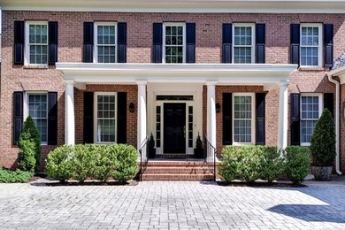 This all-brick colonial sits on a private end lot and offers a - photo 2