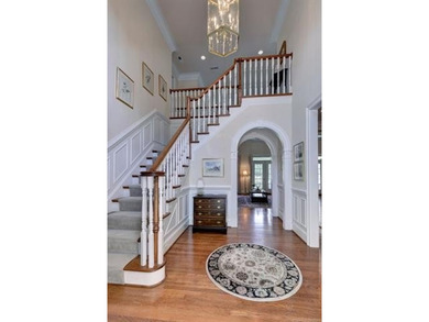 This all-brick colonial sits on a private end lot and offers a - photo 3