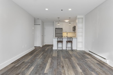 Tastefully remodeled first floor unit with a unique