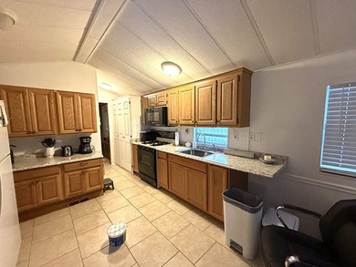 This charming 704 square foot mobile home was built in 1991 and - photo 3