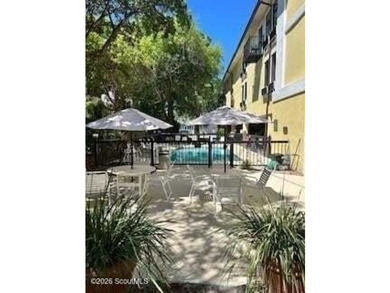 Discover the charm of Pier Village in this beautifully located - photo 3