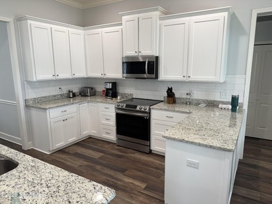 House features a large lot on approximately 30 Acre Lake, Stucco - photo 6