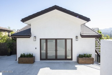 A modern residence defined by glass, light, and landscape. - photo 2