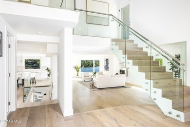 A modern residence defined by glass, light, and landscape. - photo 3