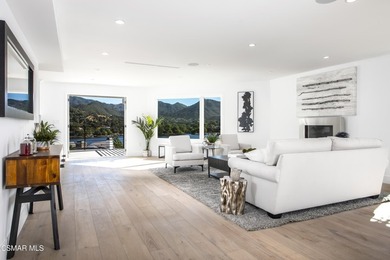 A modern residence defined by glass, light, and landscape. - photo 4