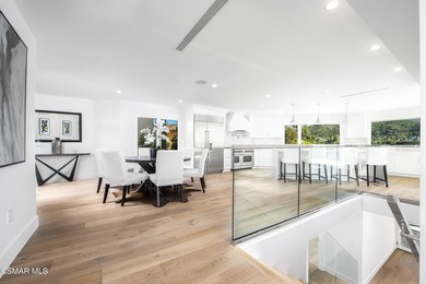 A modern residence defined by glass, light, and landscape. - photo 6