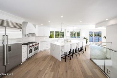 A modern residence defined by glass, light, and landscape. - photo 7