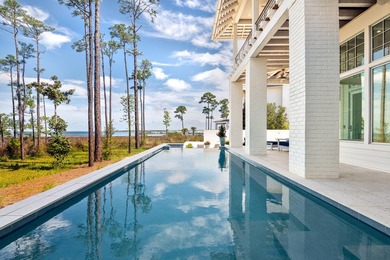 Located in the prestigious gated waterfront community of - photo 8