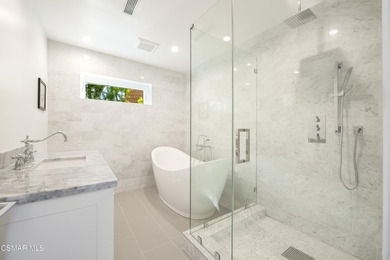 A modern residence defined by glass, light, and landscape. - photo 10