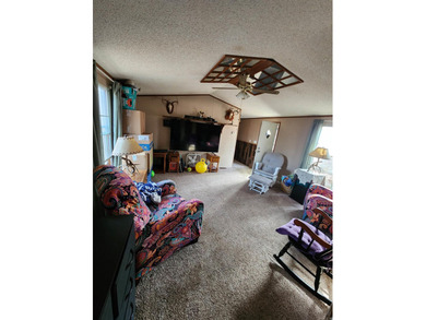 Peaceful country living awaits on this 3.4 acre wooded property