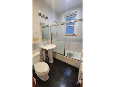 Welcome to this Extra Large 2 family brick house! Situated in - photo 8