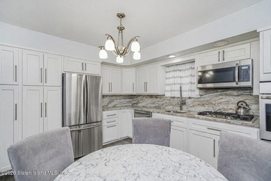 Welcome to 25 Morgan Lane, a charming brick home located in the - photo 7