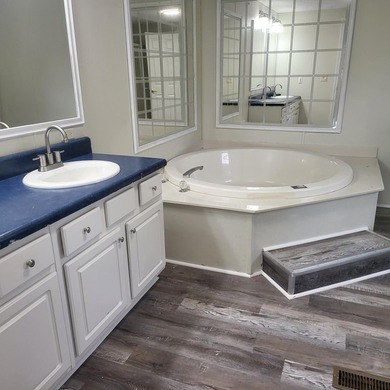 Welcome to this 1,900-square-foot mobile home situated on 5 - photo 13
