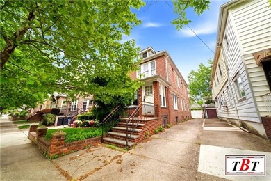 Welcome to 1073 East 3rd Street, a one family brick home sitting - photo 3