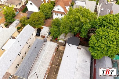 Welcome to 1073 East 3rd Street, a one family brick home sitting - photo 8